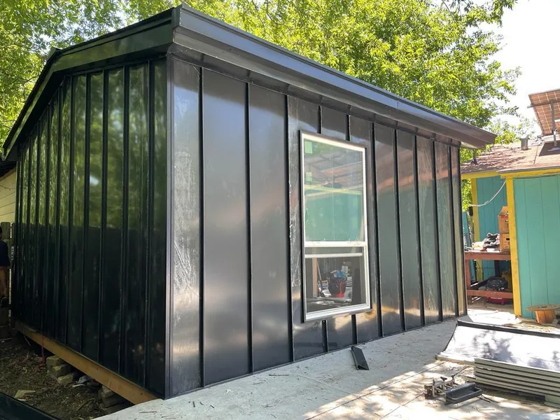 Black standing seam metal wall panels for Roof Inspection in Concord